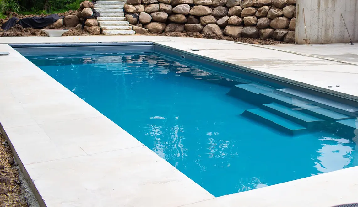 Leisure Pools The Grand rectangular fiberglass pool side view by Leisure Pools Athens